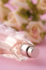Bottle of perfume with roses