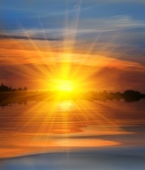 Obraz premium dramatic sunset on a river