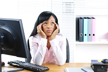 Bored black businesswoman in office