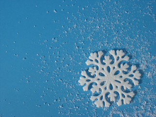 White snowflake on cyan background