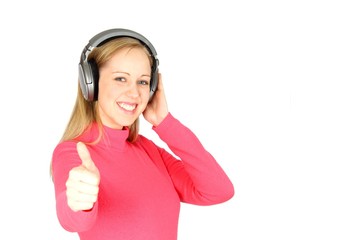 Beautiful girl with enjoying music and giving thumbs up