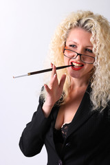 Obraz premium Pretty woman with a mouthpiece. Curly blonde on the grey