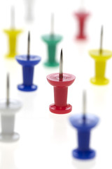 multicolored pushpins isolated on a white background