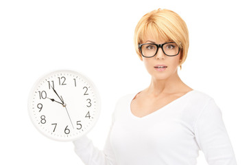 woman holding big clock