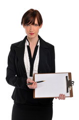 Businesswoman holding clipboard and pen