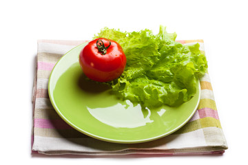 tomato and lettuce on a dish