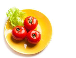 tomato and lettuce on a dish