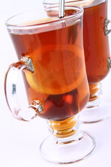 Two glasses of tea with lemon
