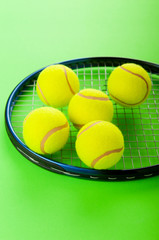 Tennis concept with balls and racket