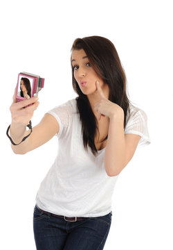 beautiful casual woman taking her own pictures on a digital phot