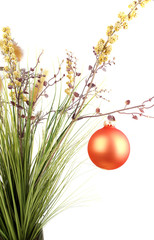 Bunch with artificial grass with christmas decoration.