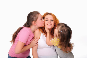 young pregnant mother and her two daughters