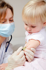 Little baby girl gets an injection