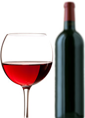 Glass of red wine and a bottle