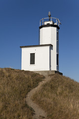Fototapeta na wymiar Lighthouse With Dirt Path