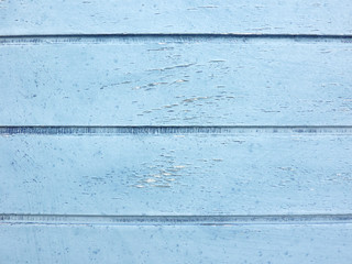 Fototapeta na wymiar wood strips painted blue, old door detail