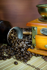 coffee beans, pot and grinder on sack