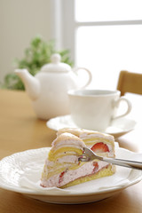 Strawberry cake and coffee on the table