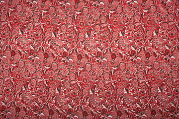 Beautiful red fabric with a pattern from colors