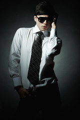Obraz premium Fashion portrait of the young businessman
