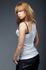 Fashion photo of young sensual woman in jeans