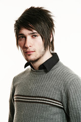 Portrait of a serious handsome man isolated over white