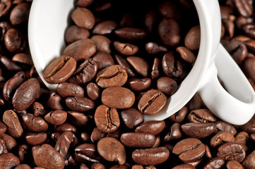 Cup of coffee on beans