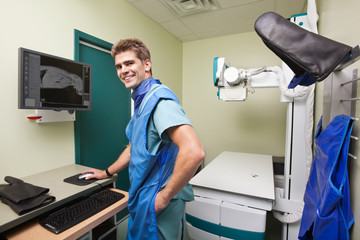 Radiologist examining  X-ray of dog's spine