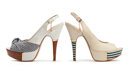 Two female open-toe shoes on the white background