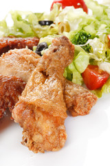 Roasted chicken legs with salad