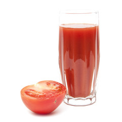 Fresh tomatoes and a glass full of tomato juice