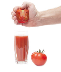 juice from tomato in male hand