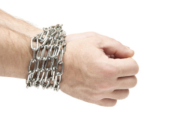 man's hands tied with chains