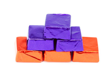 candies in shiny wrappers isolated on white