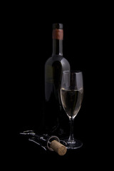 White wine bottle and glass with corkscrew