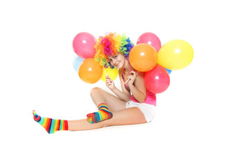 Fototapeta na wymiar young happy woman with balloons over white