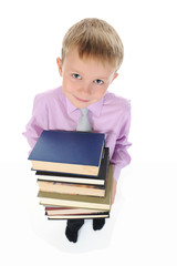 boy holds a stack of books