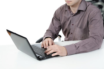 Hands on the laptop keyboard.