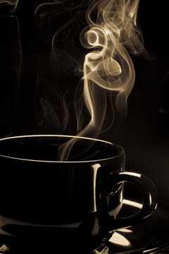 Steaming black coffee cup