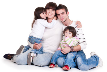 Happiness family with two children isolated on white