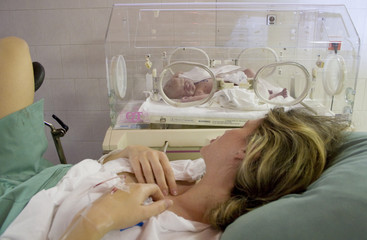 newborn baby with mother after delivery - obrazy, fototapety, plakaty