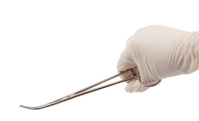 Hand with a surgical instrument