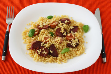 Fried sausages with couscous