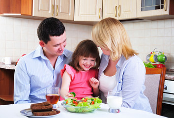 Dad, Mom and their little daughter