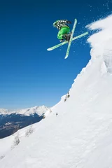 Raamstickers Jumping skier in mountains © dell