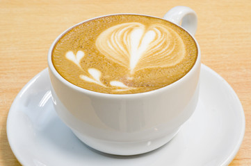 heart symbol on latte coffee cup