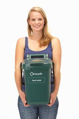 Young woman holding recycling container