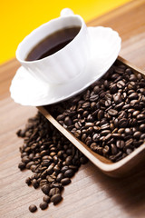 Coffee beans in a cup