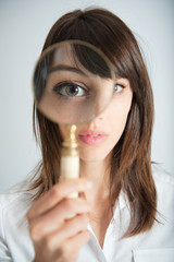 Girl with magnifying glass