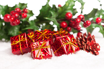 gift boxes with pinecone and european holly